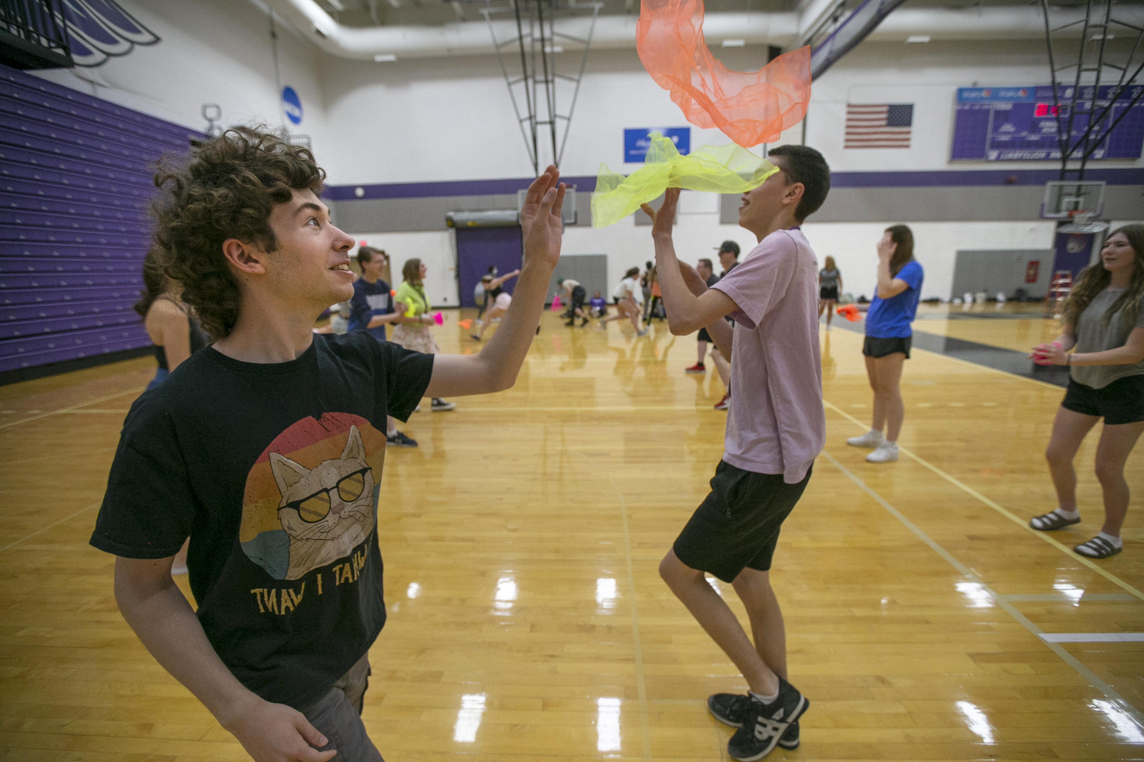 Students play in a gym.