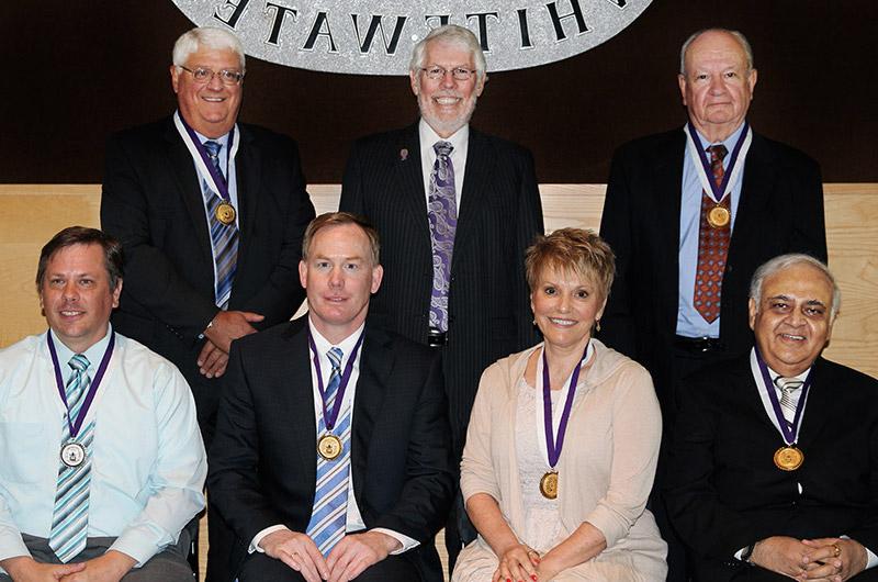 Award recipients with Chancellor Telfer (back left to right) Major General Grant R. Mulder '63, Chancellor Richard J. Telfer, Donald R. McIlnay '72 MBA '73 (front left to right) Jaydev H. Raja MBA '75, Karen L. Ahlgrim '73, Shawn M. Eichorst '90, Mathew T. Benson '02 