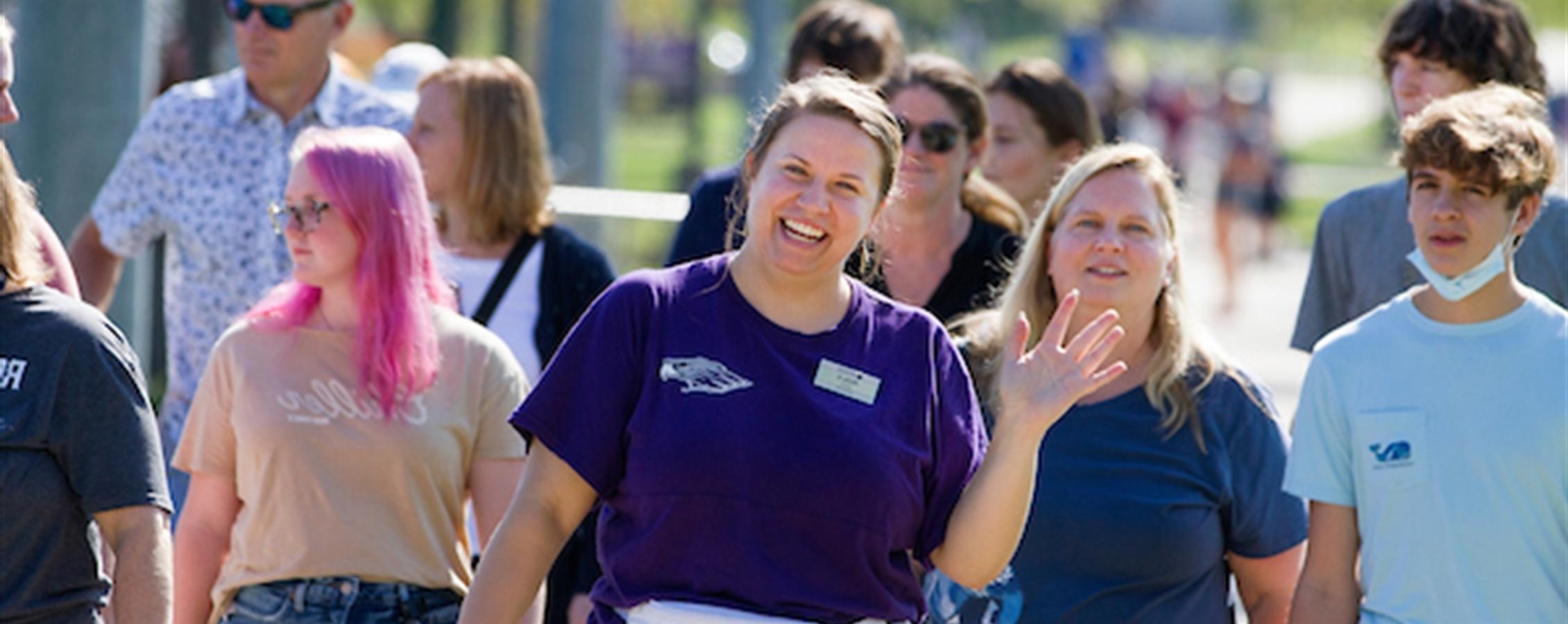 Students smile as they tour campus