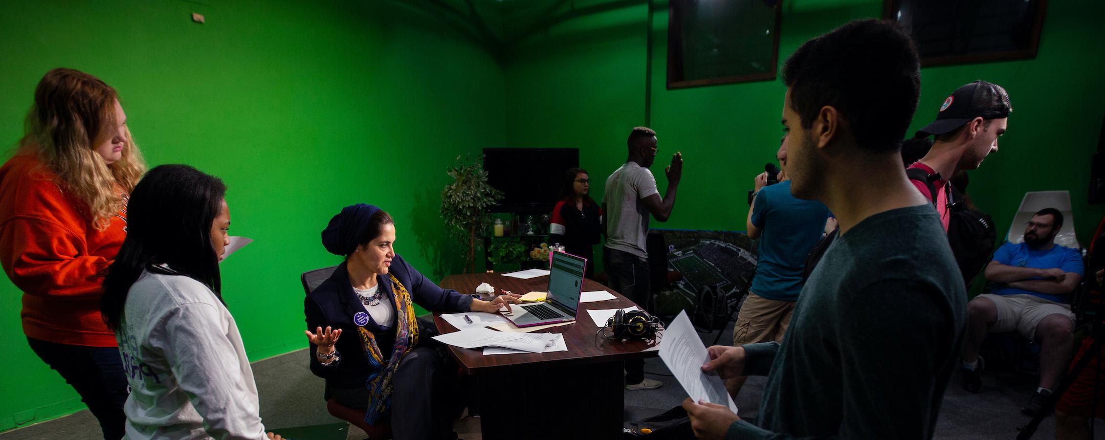 Theatre students rehearse with a professor for the next performance