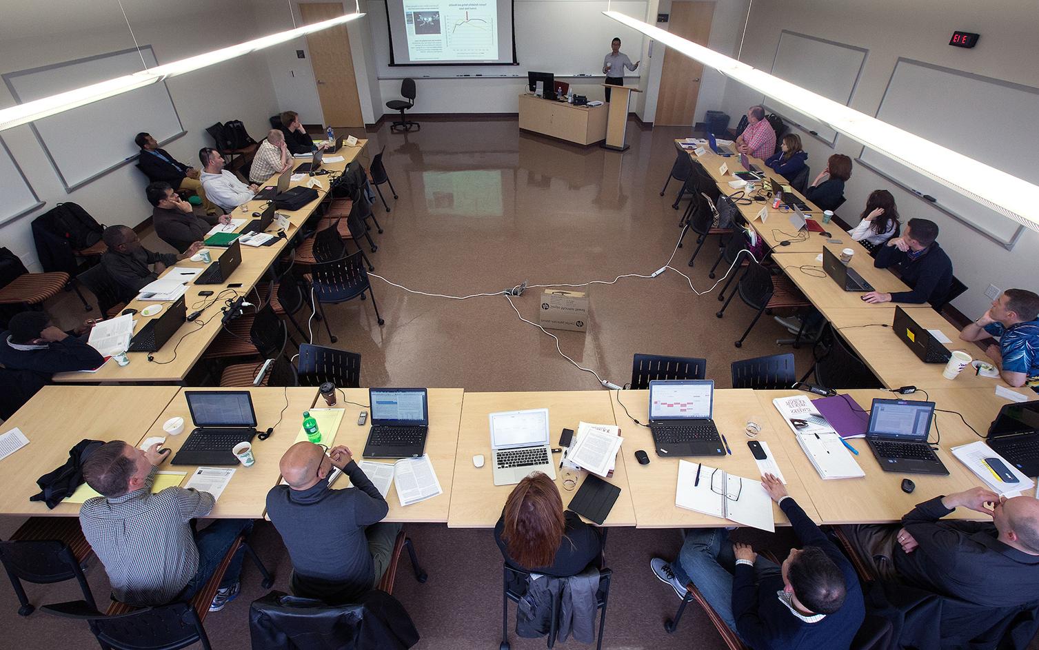 Henry Balani, seated at right with a green binder in front of him, was a member of the first cohort of <a href='http://ekdlxw.hiqgo.com'>足彩平台</a>’s DBA program.