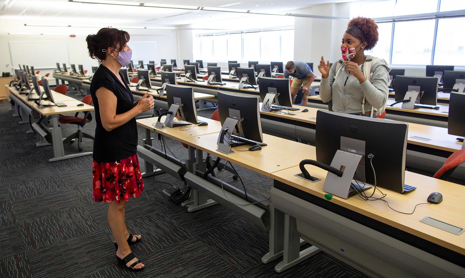 A human resources management major consults with Lecturer Linda Amann after an Information Systems 280 class in Hyland Hall on Sept. 2, 2020..