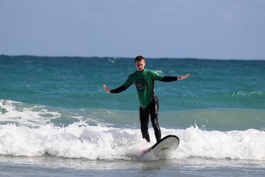 A person surfing in the ocean.